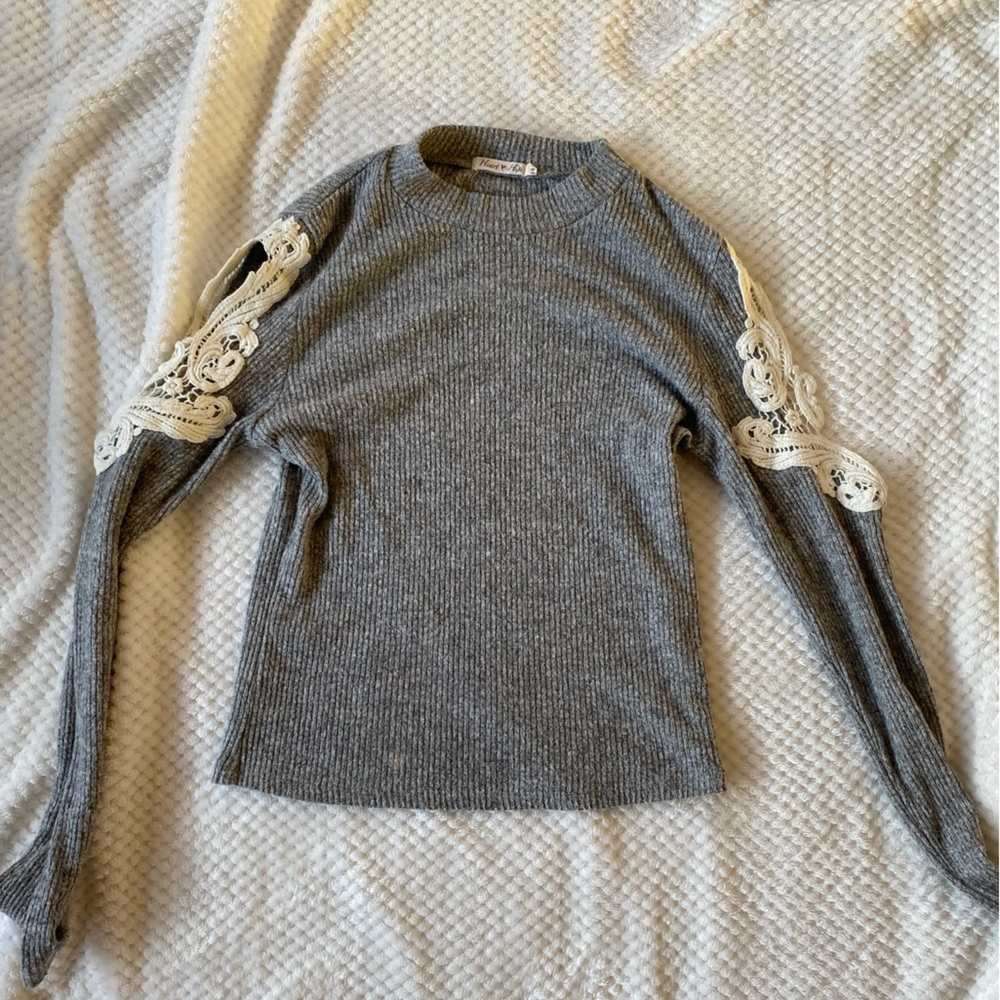Grey crop sweater with open lace detailing on sleeves